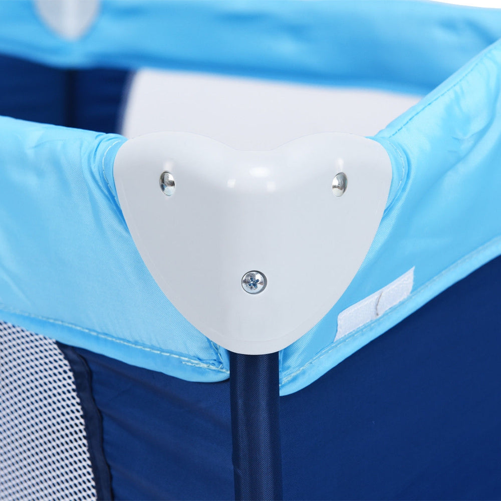 Close-up of the corner joint of the blue foldable baby crib playpen with mosquito net, designed for travel convenience.