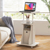 Adjustable mobile standing desk cart in white with tilt desktop, two shelves, and cabinet for versatile workspace use.