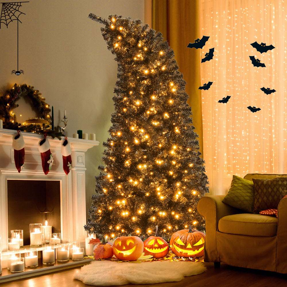 Bendable top 7 ft artificial Christmas tree with black leaves and warm LED lights, perfect for unique holiday displays.