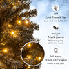 Close-up of the 7 ft artificial Christmas tree with black leaves and warm LED lights, creating a cozy holiday ambiance.