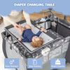 Portable baby changing table with safety belt, gray fabric, easy cleaning, for convenient diaper changes.