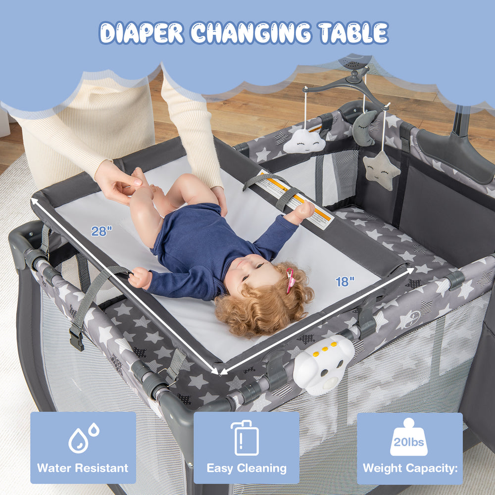 Portable baby changing table with safety belt, gray fabric, easy cleaning, for convenient diaper changes.