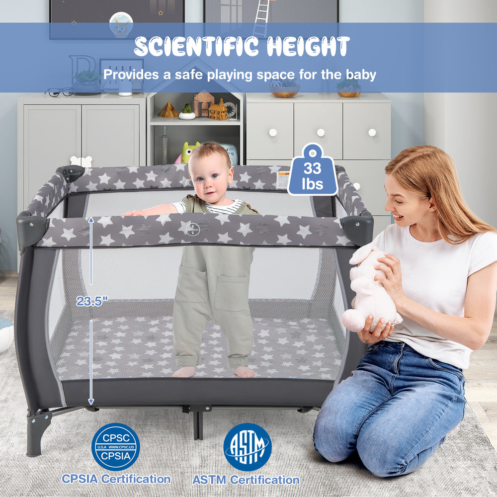 Portable baby playard in gray with changing table, mesh sides, and music box, providing a safe play space for infants.
