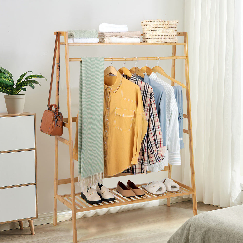 Bamboo clothing rack with hanging rod and 2-tier shelves, ideal for bedroom or entryway storage and organization.