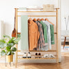 Bamboo clothing rack with hanging rod, 2-tier shelves, and side hooks, perfect for bedroom or entryway storage.