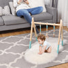 Wooden baby exercise activity gym with a triangular design in blue, featuring hanging toys for safe and engaging.