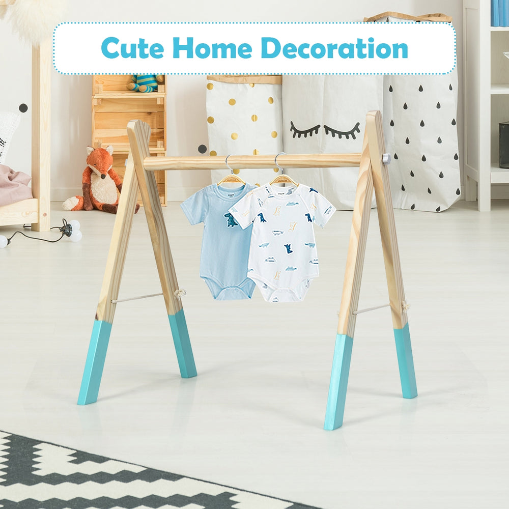 Wooden newborn baby activity gym with blue accents, promoting physical and mental development, ideal for small spaces.