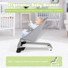 Ergonomic baby bouncer seat in light gray with aluminum frame, designed for soothing and full-body relaxation.