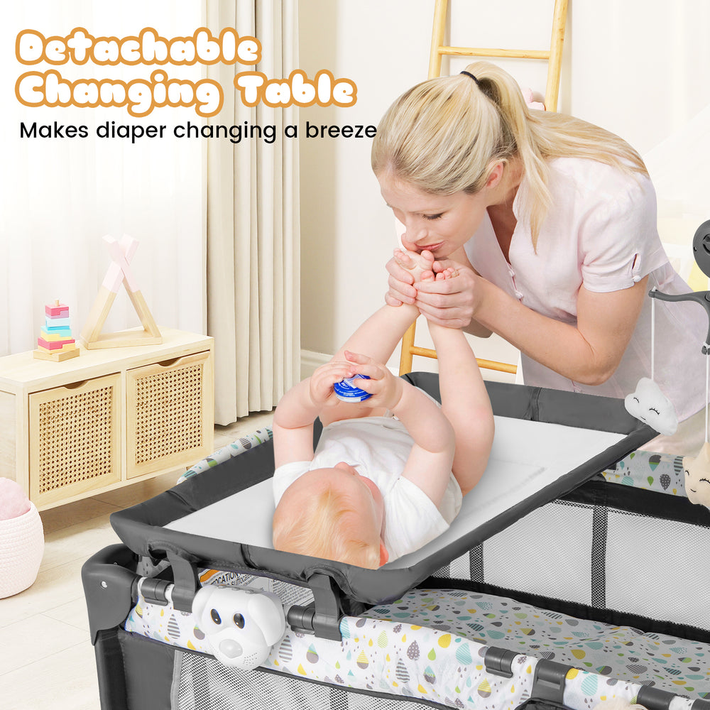 Detachable changing table on a multi-functional baby playpen in beige, designed for easy diaper changes and convenience.