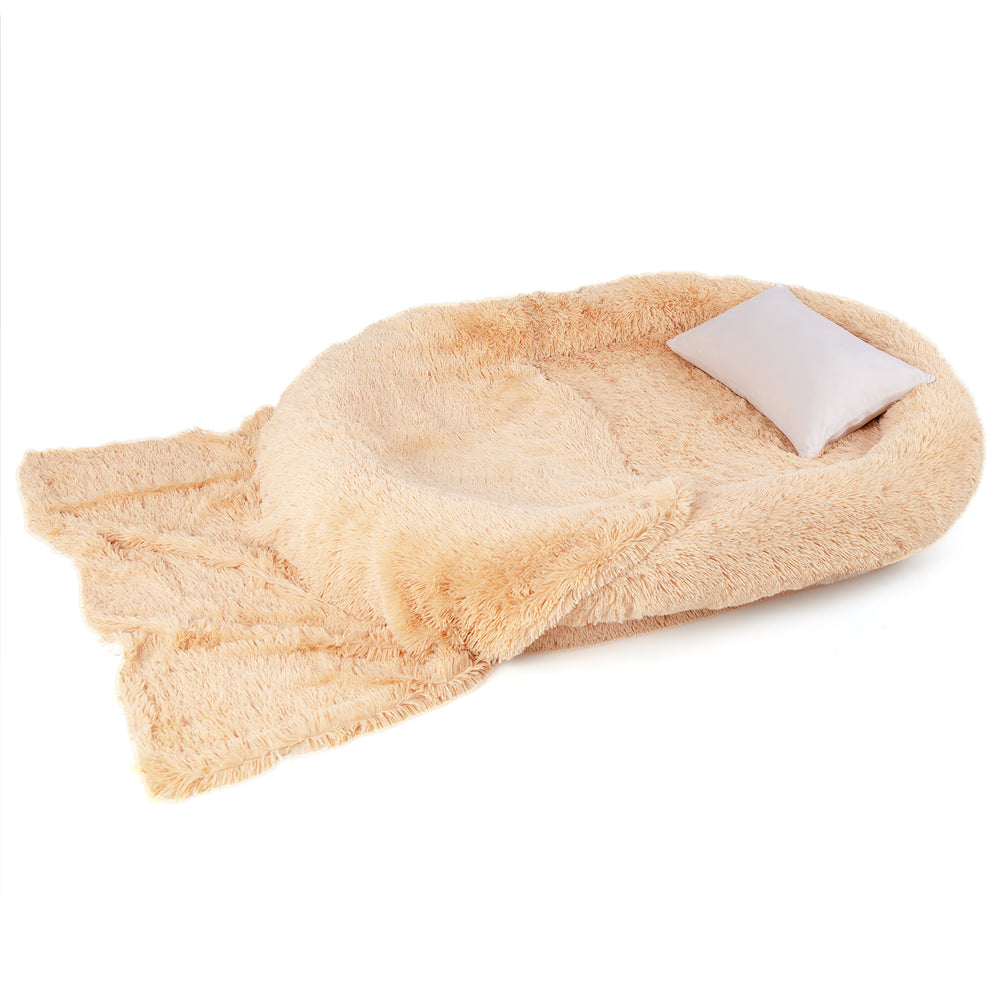 Fluffy human dog bed in brown with soft blanket and pillow, featuring orthopedic foam for comfort and removable cover.