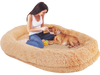 Cozy brown washable human dog bed with soft blanket, plump pillow, and bolsters for pet interaction and relaxation.