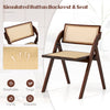 Foldable dining chair with woven rattan backrest, sturdy rubber wood frame, and space-saving design for easy storage.