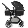 Side view of the black 2-in-1 foldable baby stroller with adjustable canopy and large storage basket for convenience.
