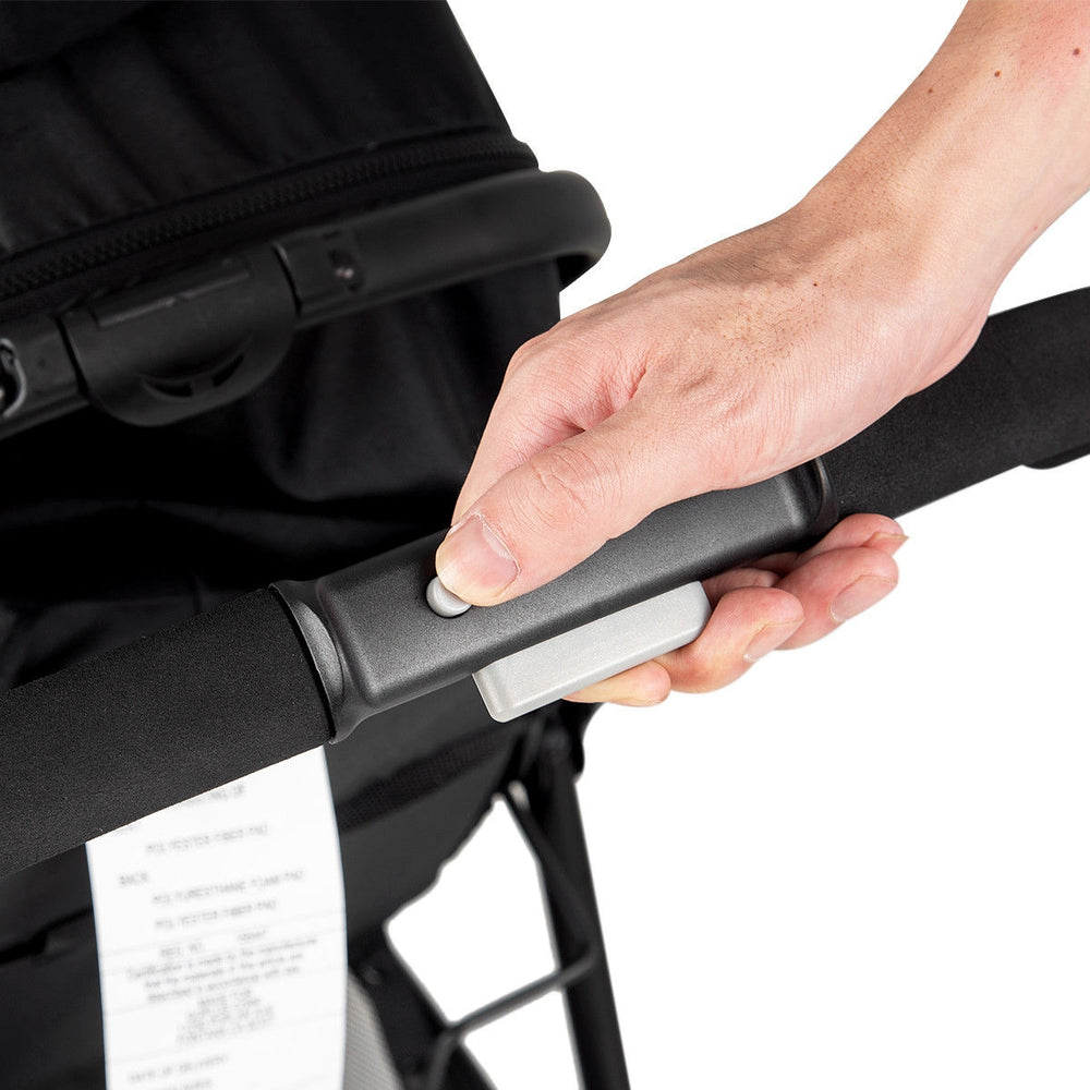 Close-up of the adjustable handle on the 2-in-1 foldable baby stroller in black, designed for comfort and convenience.