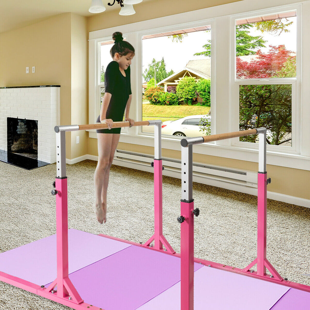 Kids adjustable gymnastics parallel bars in pink, height 38" to 55", designed for exercises and coordination skills.