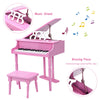 Mini grand piano in pink with 30 keys, matching bench, and music stand, ideal for children aged 1 to 7.