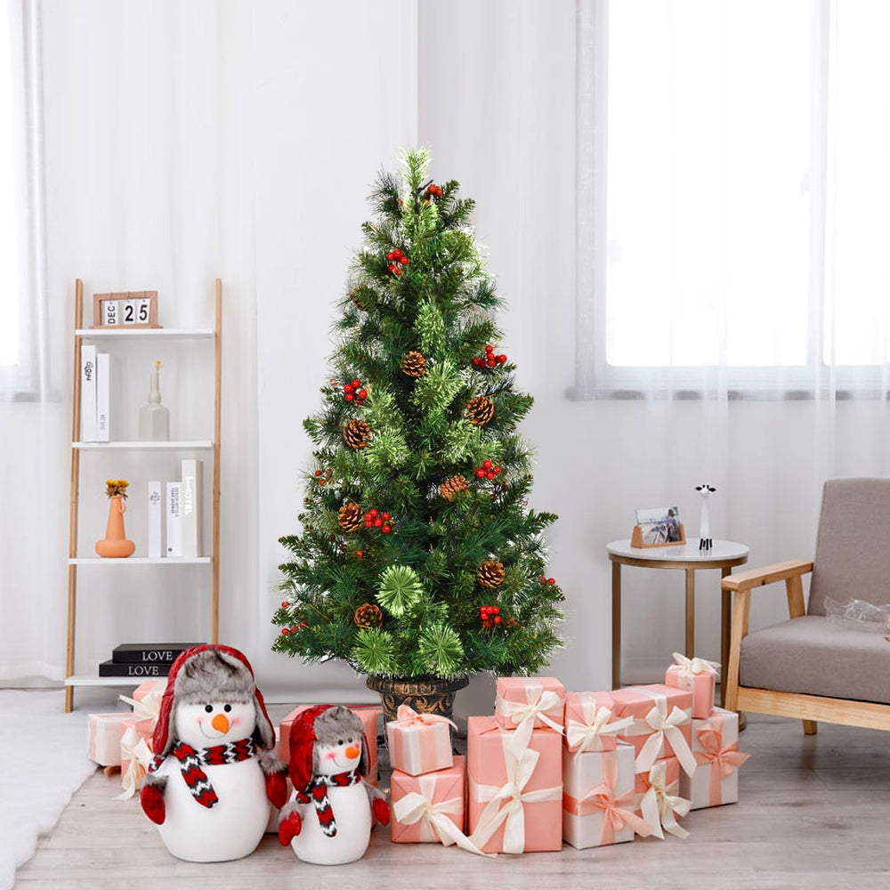 3-foot LED Christmas tree with red berries and pine cones, pre-lit with warm white lights, perfect for festive decor.