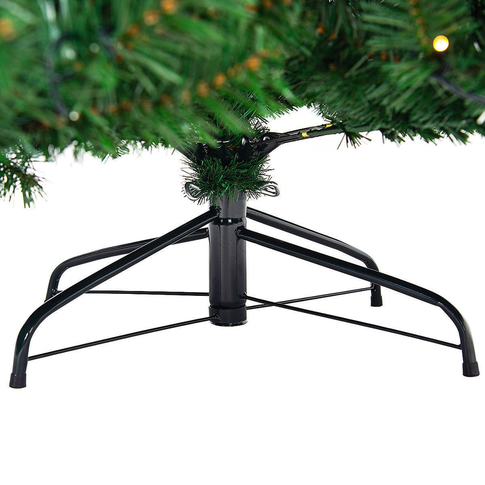Sturdy metal base of a 9 ft pre-lit PVC Christmas tree, supporting 2028 branch tips and 700 warm white LED lights.