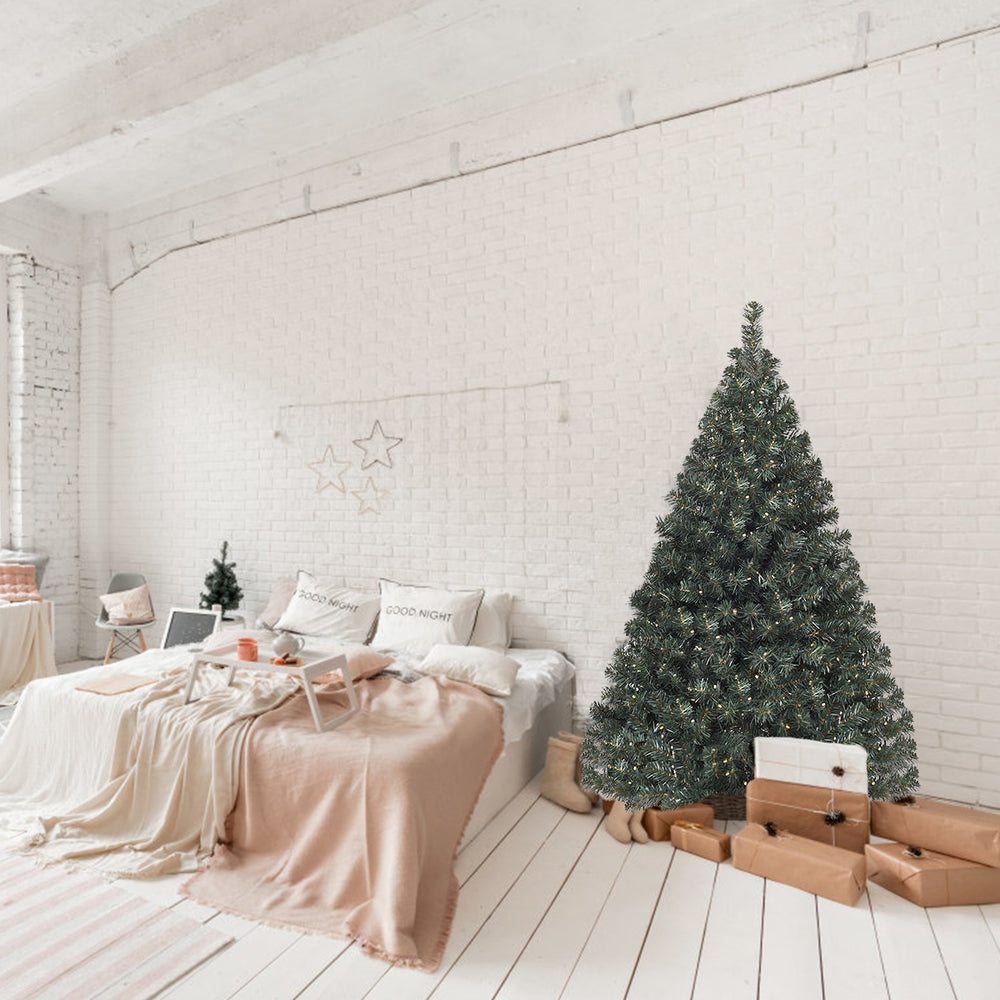 4.5 feet pre-lit artificial Christmas tree with 200 LED lights, set in a cozy indoor space for festive decoration.