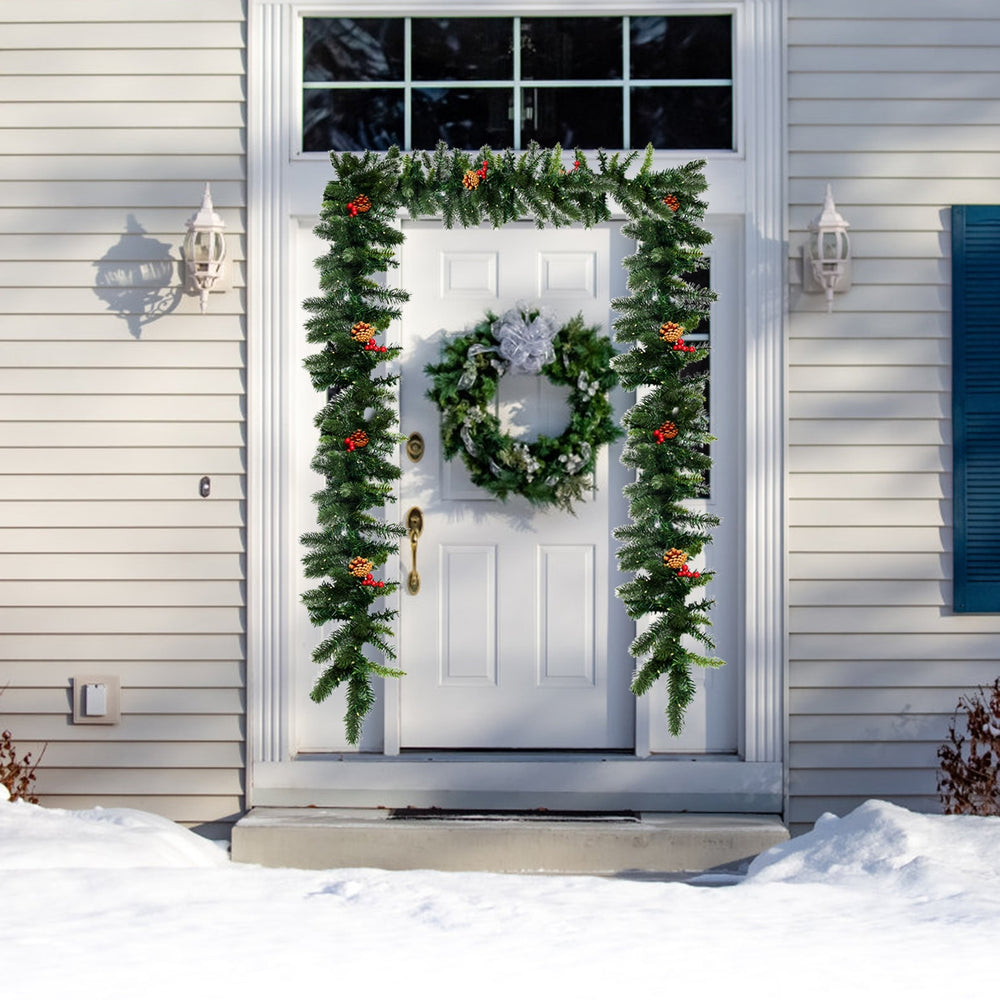 9FT pre-lit artificial Christmas garland adorned with red berries and pine cones, designed for vibrant holiday.