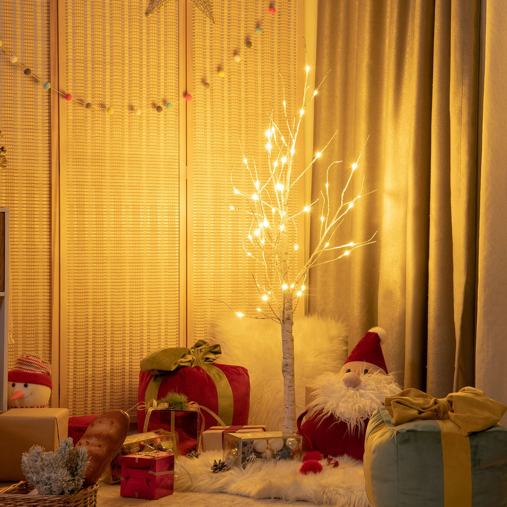 Pre-lit 4 ft white twig birch tree with 48 LED lights, creating a festive atmosphere for holiday indoor decoration.