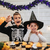 Flexible 9-foot pre-lit Halloween garland with 50 purple LED lights, ideal for unique decorations and adding a spooky.