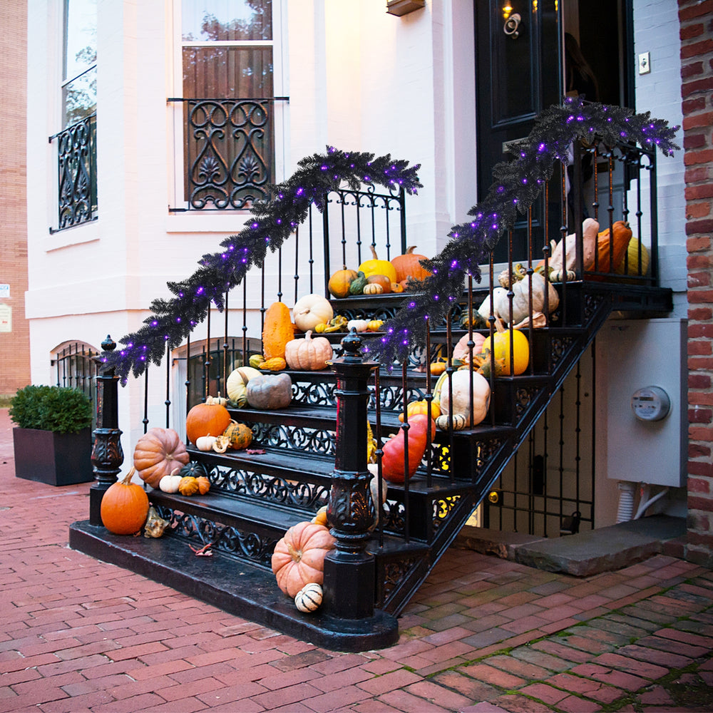 Black pre-lit Halloween garland with 50 purple LED lights, perfect for festive decoration and creating a spooky.