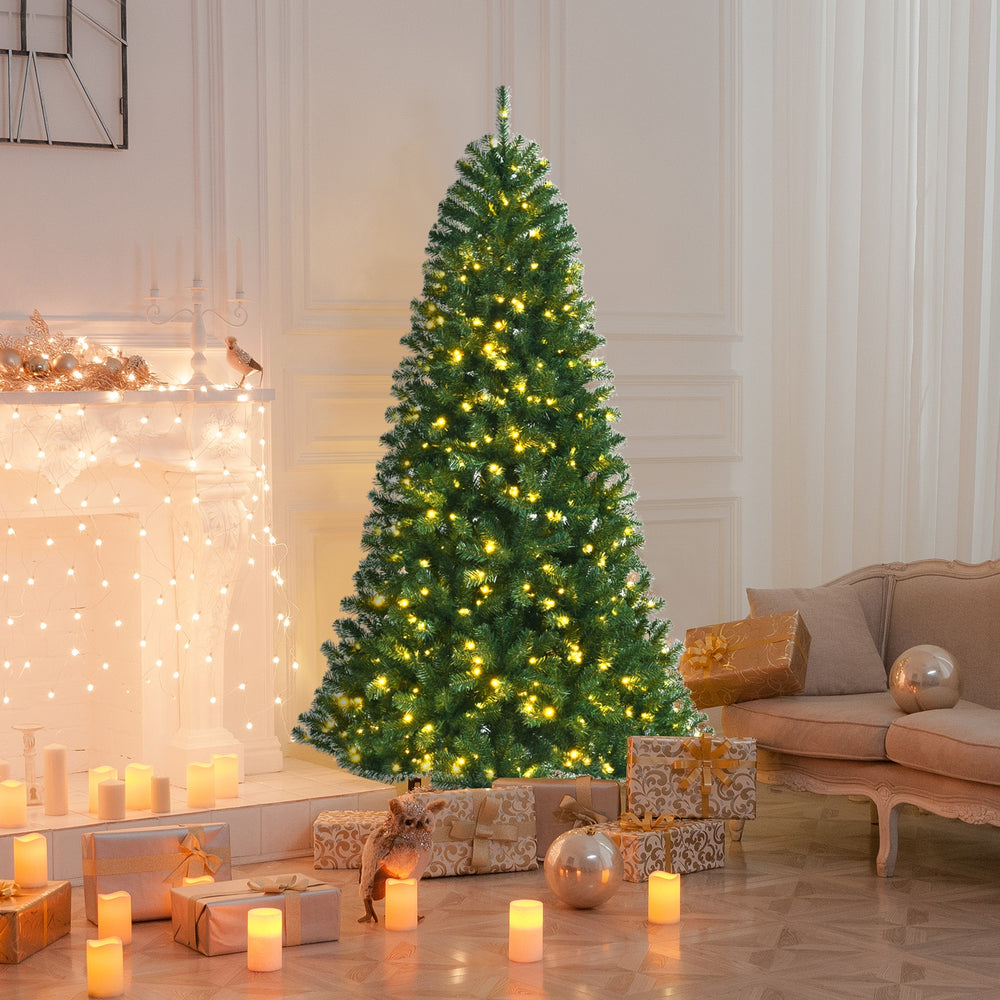 Artificial 7' hinged Christmas tree with remote-controlled color-changing LED lights, decorated in a cozy living room.