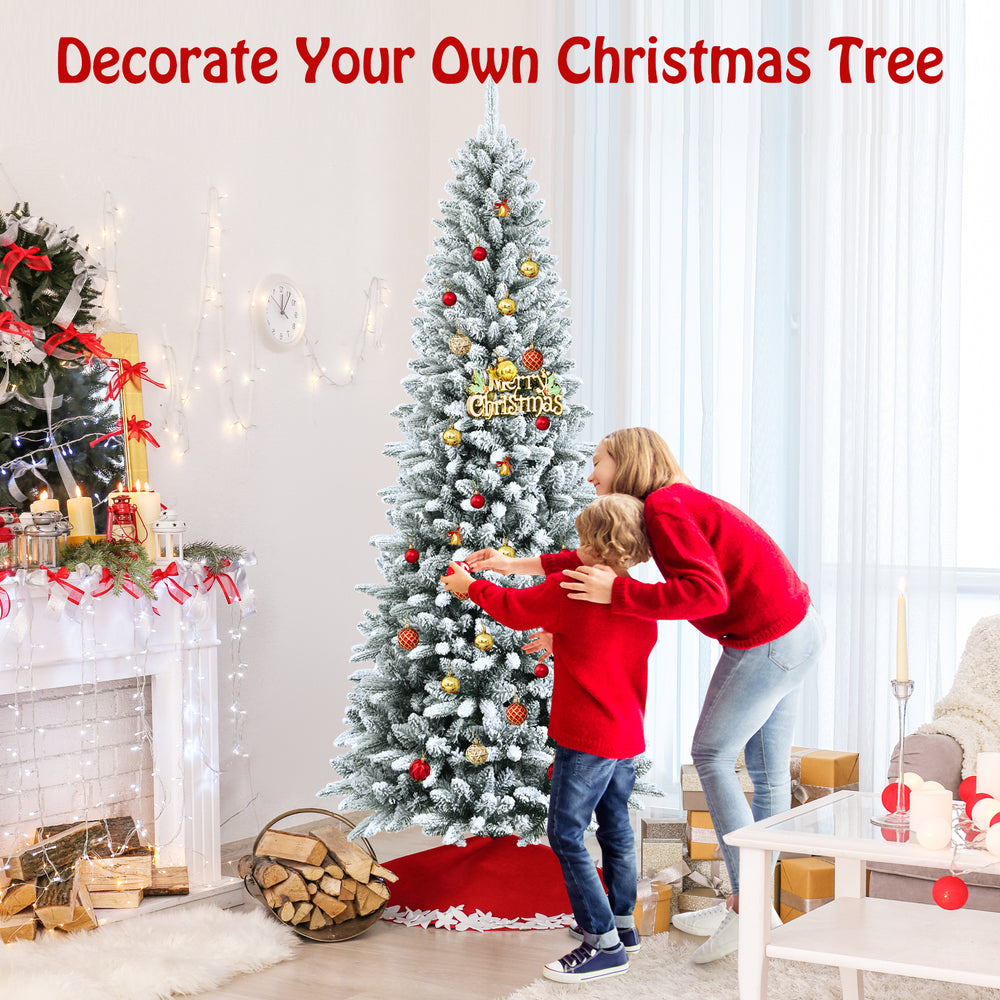 Snow-flocked 7.5 ft artificial Christmas pencil tree with vibrant ornaments, ideal for creating joyful holiday memories.