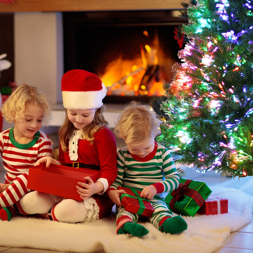 Pre-lit multi-colored fiber optic spruce artificial Christmas tree, 5 ft tall, creating a festive atmosphere with.