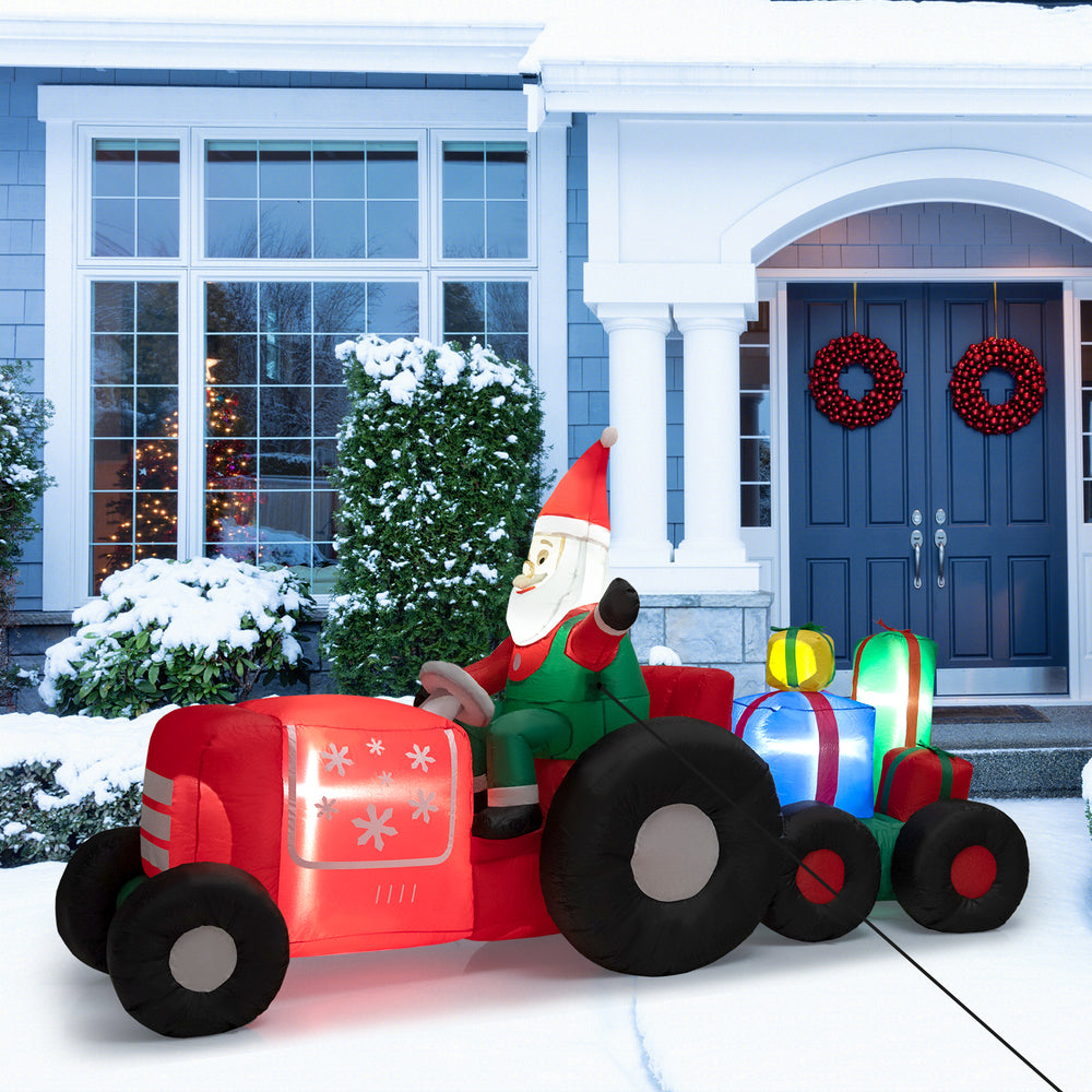 Colorful inflatable Santa Claus on a tractor with gifts, 9 feet long, ideal for brightening up your holiday yard decor.