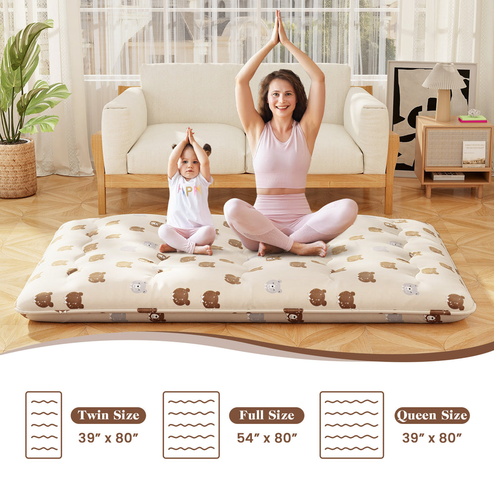Foldable full-size futon mattress with washable cover, ideal for camping or as a floor mat, shown with a child and.