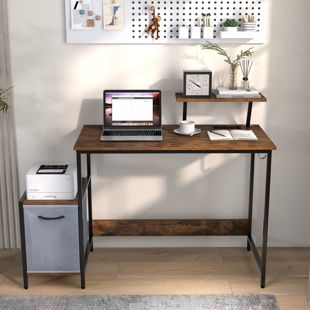 Computer desk with brown wood finish, moveable shelf, and reversible drawer, ideal for home or office use.