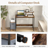 Computer desk featuring a heavy-duty metal frame, reversible storage drawer, and moveable shelf for versatile use.