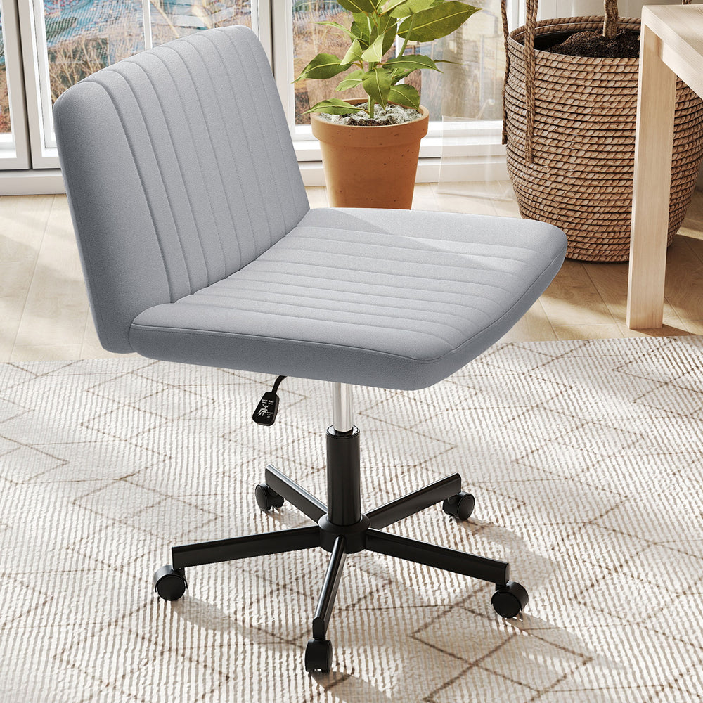 Gray Criss Cross Chair with wheels features a wide padded seat and adjustable height for comfortable desk use.