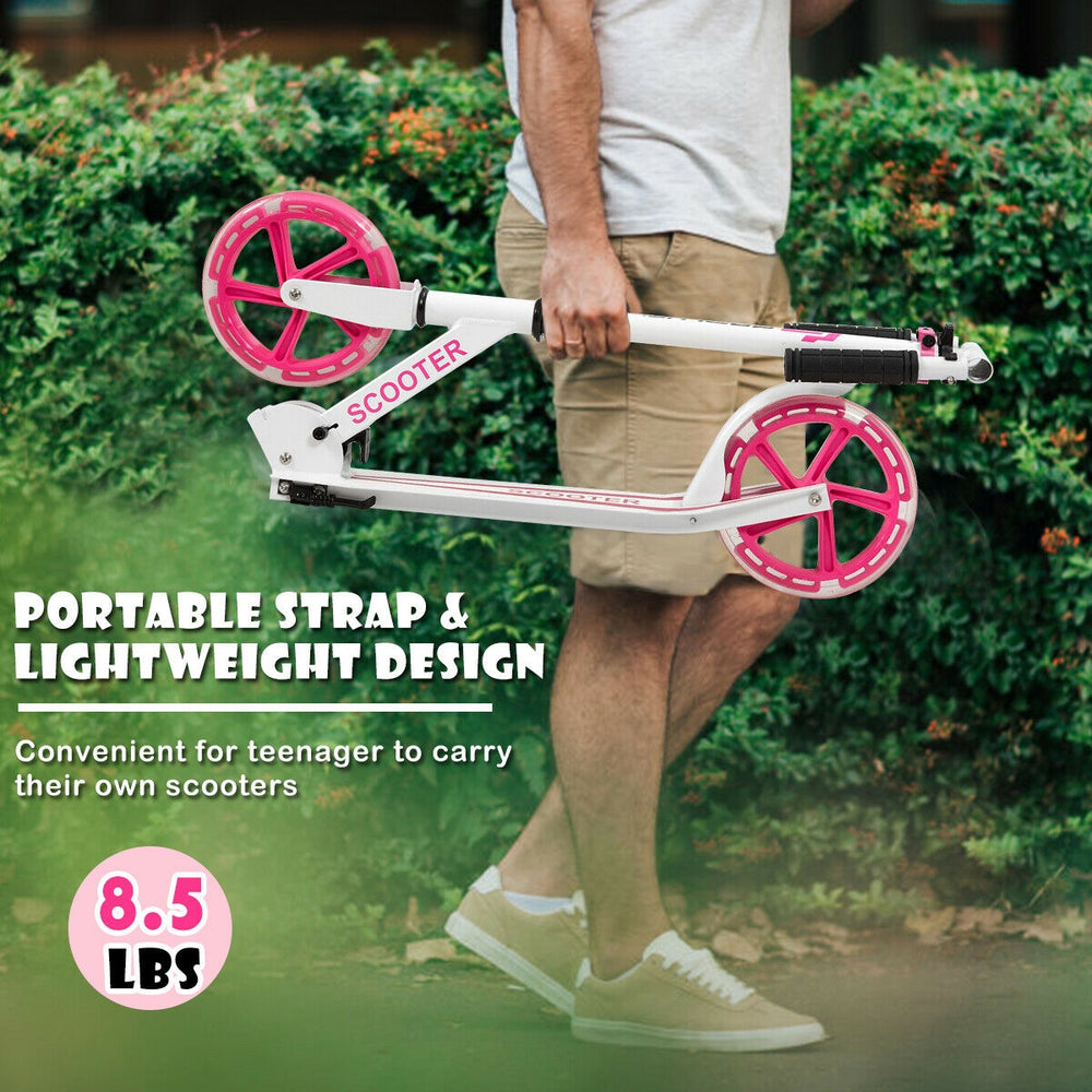Portable folding sports kick scooter in pink, featuring LED wheels and a lightweight design for easy carrying.