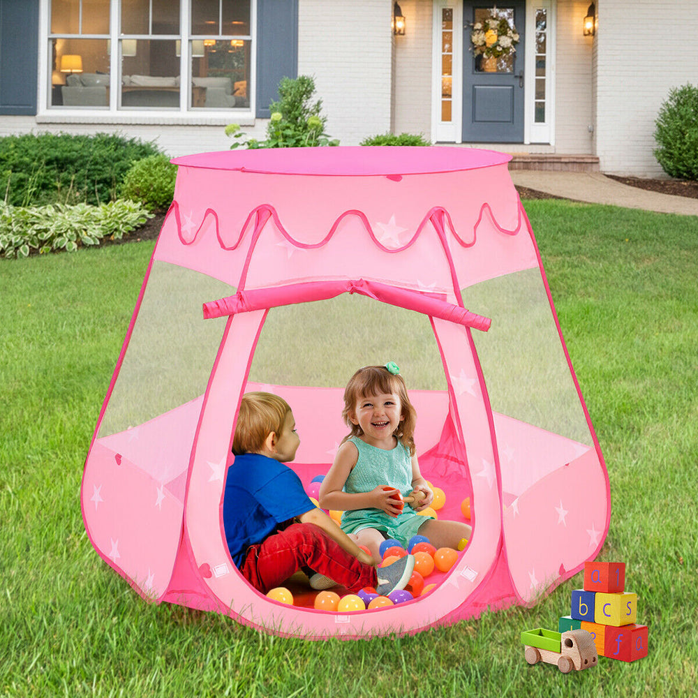 Pink portable kid play tent with mesh windows, featuring children playing inside with colorful balls in a backyard.