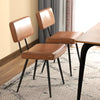 Set of 2 brown dining chairs with padded backrest and seat, featuring waterproof PU leather and sturdy metal legs for.