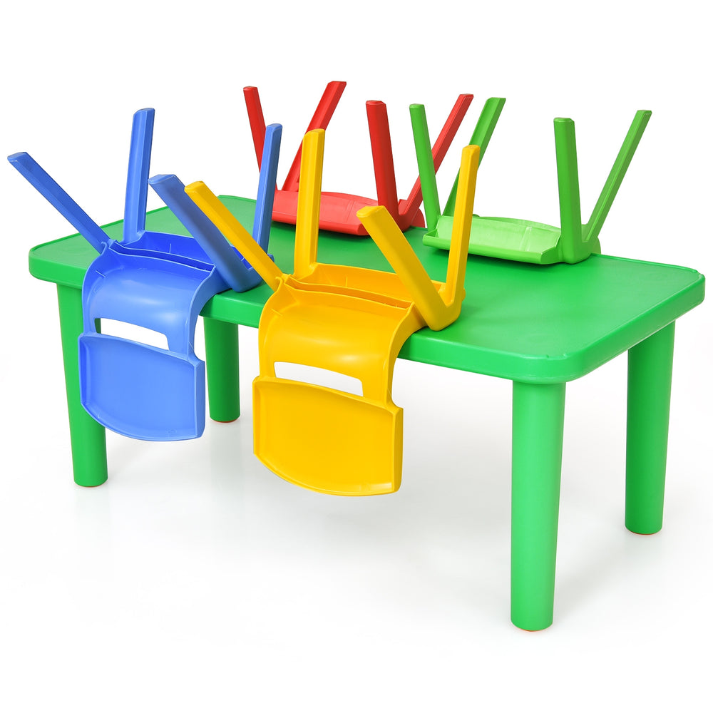 Colorful plastic table with four stacked chairs in blue, yellow, red, and green, perfect for kids' playroom activities.