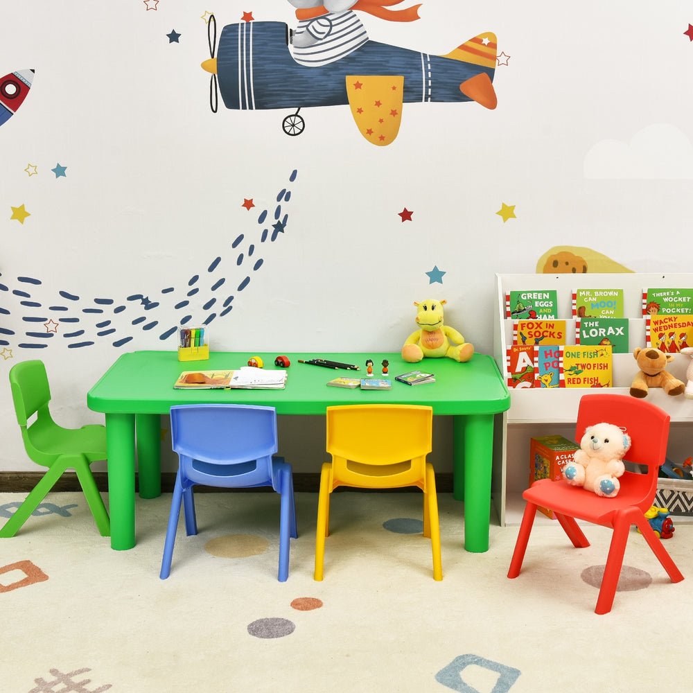 Colorful plastic table and four chairs set with rounded corners, perfect for kids' playroom or learning activities.