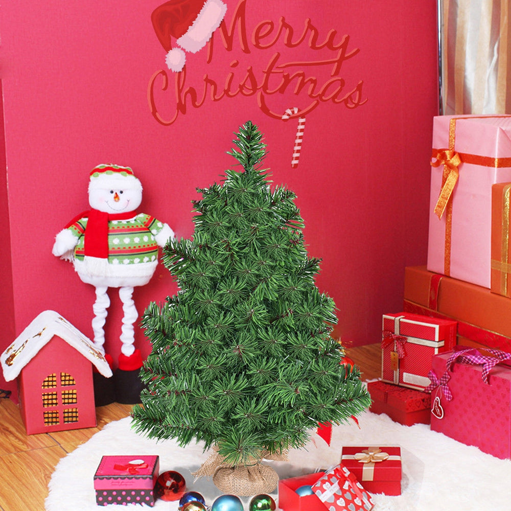 2 ft artificial Christmas tree decorated with gifts, featuring eco-friendly PVC branches and a burlap bag base for.