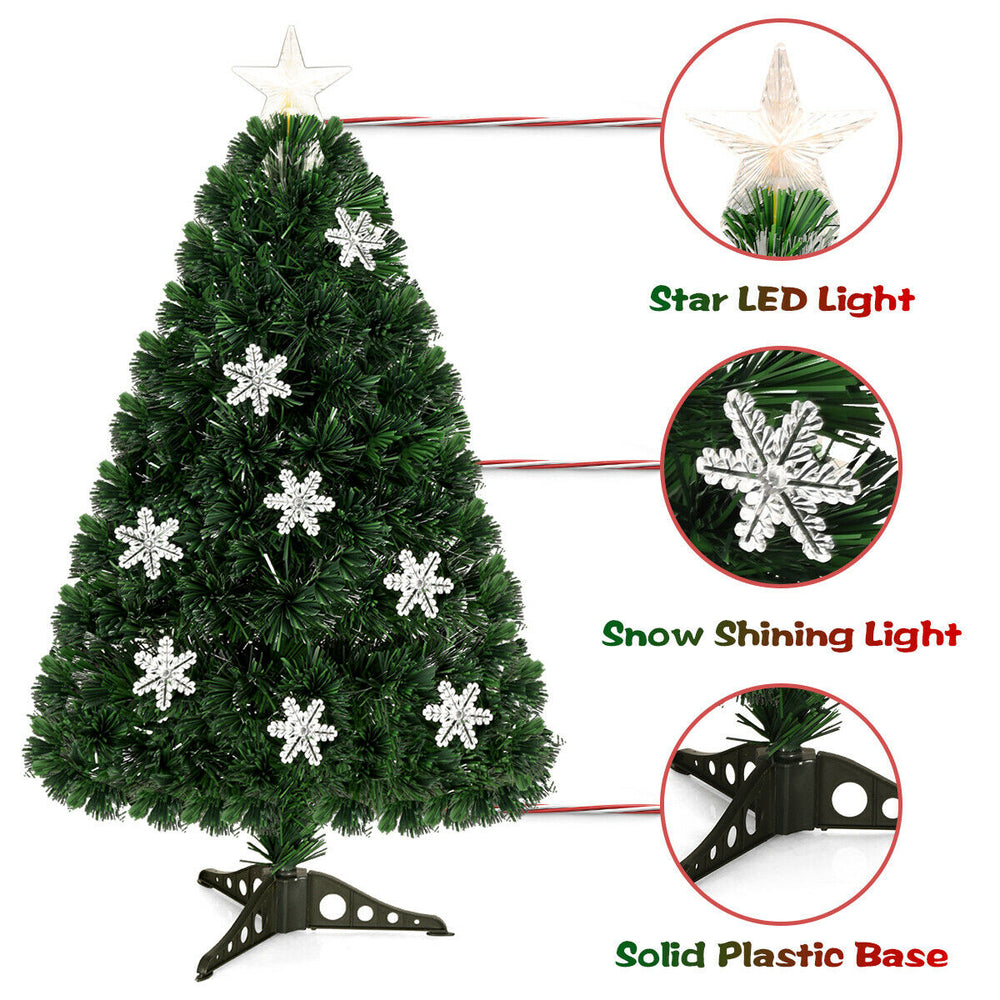 Close-up of the LED Optic Artificial Christmas Tree's star LED light and snowflake ornaments, enhancing festive.