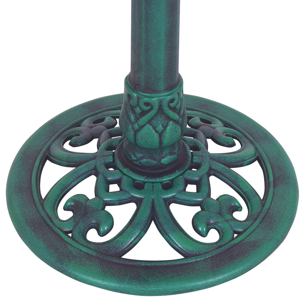 Close-up of the green pedestal base of a weather-resistant bird bath feeder, featuring an ornate design for outdoor use.