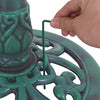 Close-up of the green pedestal bird bath feeder showing assembly with a hexagonal center and ground stake for stability.