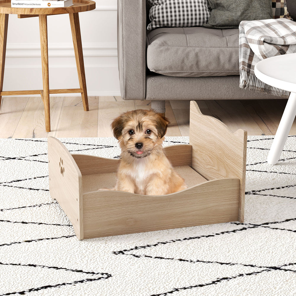 Elevated pet bed frame with ear-shaped headboards in walnut, designed for small pets like puppies and cats.