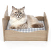 Elevated pet bed frame in walnut with ear-shaped headboards and guardrails, perfect for small pets like cats and.