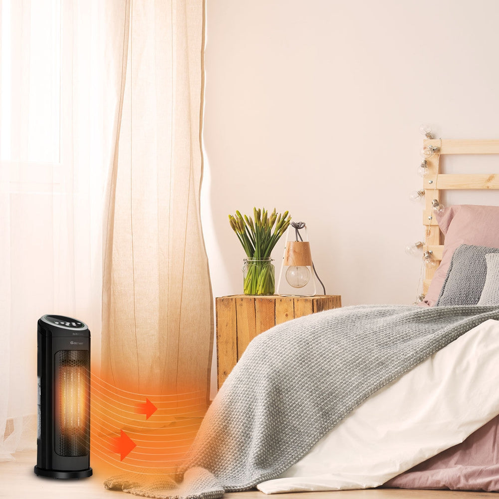 Portable 1500 W oscillating ceramic space heater in black, ideal for bedrooms and offices, providing efficient and.