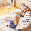 Portable mini electric oil-filled radiator heater providing 360° heating for cozy family moments in bed.