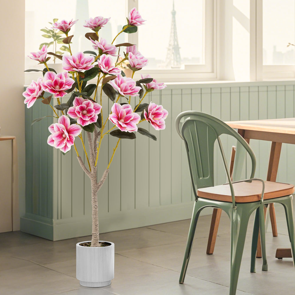 Faux wedding flower plant with 18 pink magnolia flowers and PEVA leaves in a sturdy cement pot for elegant indoor decor.