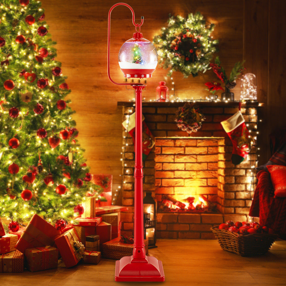 Festive 68-inch red street lamp post with a snow globe lantern, featuring colorful lights and a Christmas scene.